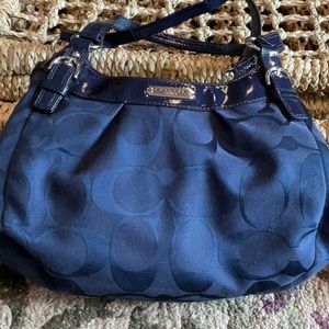 Navy blue Coach purse.